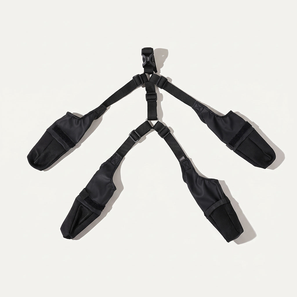 Four boots and suspender straps laid flat