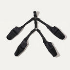 Four boots and suspender straps laid flat