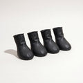 Four black rubber dog paw covers