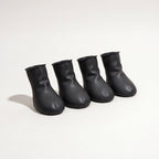 Four black rubber dog paw covers