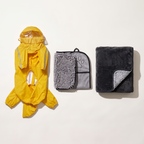 Rainy Day Kit laid out: full-body rain suit, paw towel and waterproof blanket