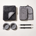 Clean Car Kit laid out: waterproof blanket, paw towel, two seat belt tethers and travel bowl