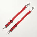 Two red dog car seat belt tethers