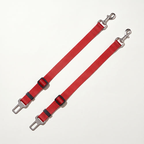 Two red dog car seat belt tethers