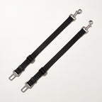 Two black dog car seat belt tethers